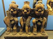 An image of a pottery piece depicting three people seated representing the Igbo deity Ifejioku