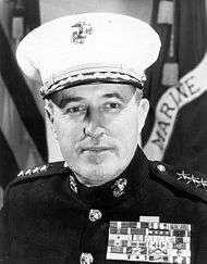 A black and white image of Raymond Davis, a white male in his Marine Corps dress uniform
