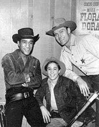 Sammy Davis, Jr., Johnny Crawford, and Chuck Connors in Western costume.