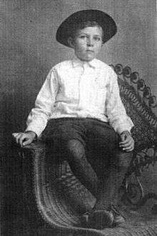 Robert E. Howard at five years old, dressed as a cowboy.