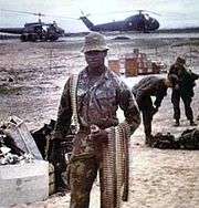 Jenkins in Vietnam with belts of ammo