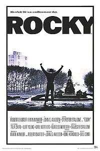 The British poster for the movie Rocky showing the Rocky character at the top of the museum's entrance steps, also known as the Rocky Steps