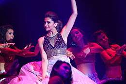 A shot of Deepika Padukone dancing with background dancets