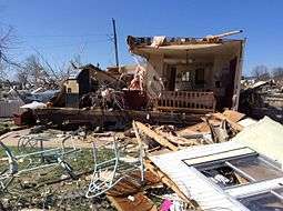 An image depicting the remains of a destroyed double-wide mobile home in Sand Springs, Oklhoma.