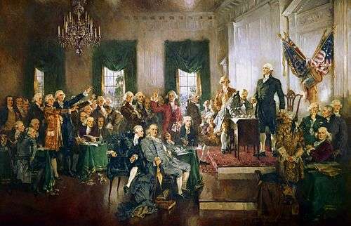 An oil-on-canvas painting of delegates to the Constitutional Convention as they signed the proposed frame of government in Independence Hall. George Washington is standing upright and looking out over the delegates.