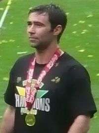Simon Lappin wearing the Championship winners medal after promotion with Norwich