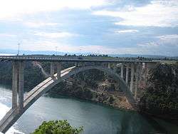 Reinforced concrete arch motorway bridge across Krka River