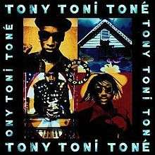 A group of four pictures is bordered by a black background with the name "Tony Toni Toné" written four times in blue.  The upper right corner photo of the group of pictures is a black and yellow image of a man in a hat and sunglasses.  The upper left corner photo depicts a white house with a dark blue sky and a blue window. The lower left photo contains a red an black image of a man with sunglasses and dreadlocks. The lower right corner photo depicts a man in a black suit and gloves with white circles on them.  He is seated in front of a piano that is facing the viewer.  In the center of the photo, a circle contains the phrase "Sons of Soul".