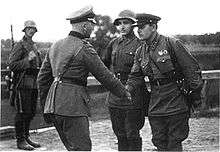 A photo of a German and a Soviet officer shaking hands at the end of the invasion of Poland