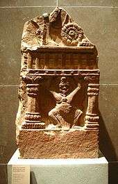 Balustrade-holding Yaksh with Corinthian columns, from Madhya Pradesh