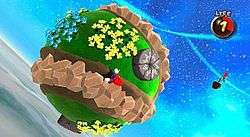 In this screenshot, Mario is running across a small, circular planetoid in outer space. The game has gravity mechanics which allows Mario to run upside down or sideways.