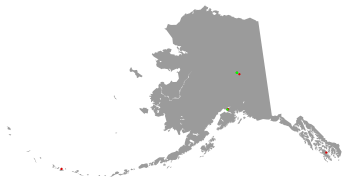 Oultine of map of Alaska with colored dots representing the location of Superfund sites in the state