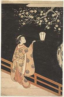 Colour print of a finely-dressed Japanese woman holding a lantern at night, admiring the plum blossoms.