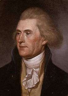 1/4 length portrait of Jefferson in 1791, showing him with a shock of red hair and wearing a dark-colored jacket, a yellow vest, and a white shirt. He is looking off toward the left, away from the viewer.