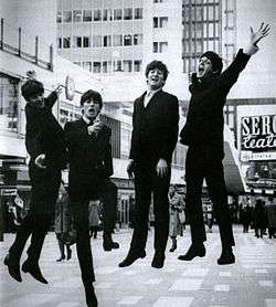 Publicity photo of the Beatles jumping in the air