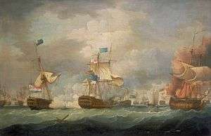 On a stormy sea beneath towering clouds, a number of sailing warships battle. In the foreground are three ships, two to the right of the frame bridged by clouds of smoke and the mainmast of the far right ship, which bears a prominent horizontally striped flag is toppling. To the left of the frame a third ship drifts as flames leap from its deck