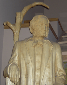 Wooden statue of a man with beard
