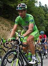 Peter Sagan wearing a green cycling jersey.