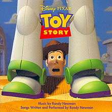 At the center of the album cover is a toy cowboy's head overlooking a bed with a shocked expression on his face. Sitting on the bed in front of him are the legs of a toy astronaut. The title of the soundtrack is at the top of the image and the production credits are located at the bottom.