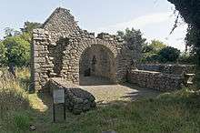 Photograph of the ruinous remains of a church