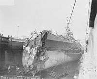 USS Washington in drydock at Pearl Harbor showing collision damage
