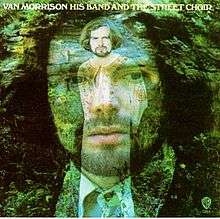 A young man with shoulder-length hair and beard wearing a shirt and tie. The man is translucent and behind him is another image of the same man wearing a white kaftan. Above the images of the man is written his name (Van Morrison) in white block capitals. "His Band and the Street Choir" is written in the same writing next to it.
