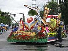 "Freedom Bird" parade float, ridden by women and children