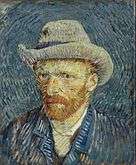  A portrait of Vincent van Gogh from the left, with a relaxed but intent look, a red beard and wearing a grey hat.