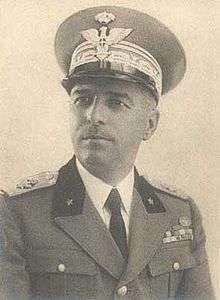a standing male in Italian uniform with peaked cap
