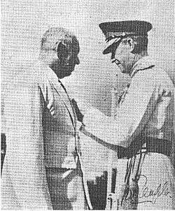 Mr. W. E. Perera receiving his insignia of the order of the M.B.E. from General Sir Gerald Templer, the High Commmissioner of the Federation of Malaya.