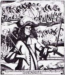 Black and white print shows a scowling man carrying a torch in each hand. The man wears a shoulder-length black wig and clothing of about 1700. In the background, a city and a farm are in flames.