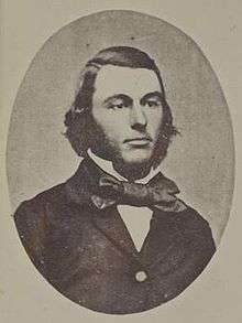 portrait photo of a man about 30 with sideburns