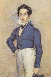 Three-quarter length portrait of youth, looking at viewer, wearing blue jacket and white trousers