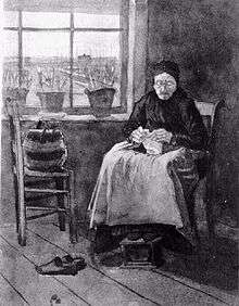  An old woman wearing a cap is seated knitting by a window. Her workbag is on a chair beside her. She has taken off her shoes and her feet are resting on a footstool. There are pots of flowers on the window sill and a view across some meadows of distant buildings through the window. The room is rather bare.